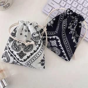 Detail of paisley print cotton drawstring pouch used as a stationery or jewelry organizer