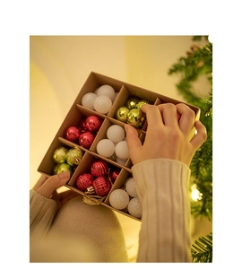 Detail of multi-color 3cm Christmas balls in kraft box with shiny and matte textures