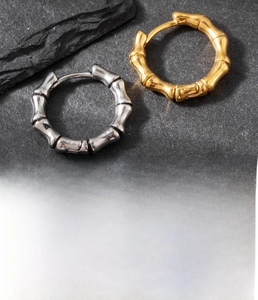 Detail of 8mm titanium steel bamboo joint earrings in gold and silver finish