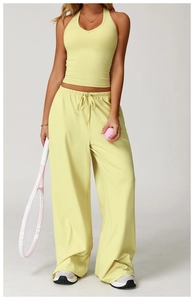 Close-up of cream yellow two-piece yoga set with racerback top and drawstring pants