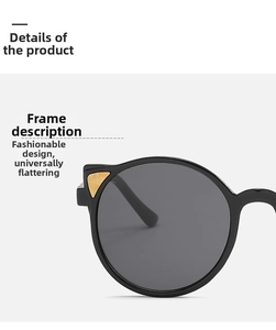 Detailed close-up of black round frames with gold triangle accents and dark lenses