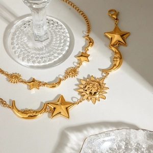 Luxurious gold stainless steel bracelet with sun, moon, and star charms in a stackable style