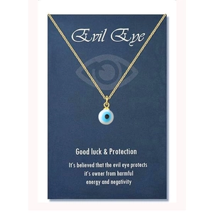 Detailed view of the Evil Eye pendant with blue eye charm and golden fine chain