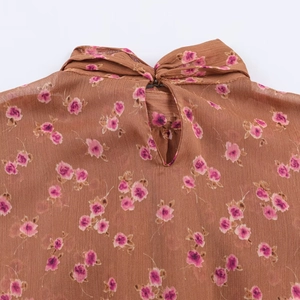 Detail of vintage brown floral chiffon top showing neck tie and teardrop back opening