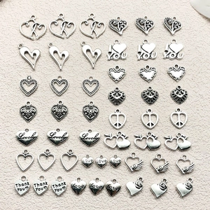 Variety of vintage silver heart charms with Love and Thank You engravings for DIY jewelry