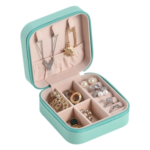 Mint green PU leather jewelry box with zipper and multi-functional velvet interior compartments