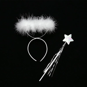 Detail of white fluffy feather halo headband and silver star magic wand set