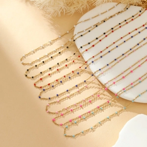 Versatile gold layered necklace with colorful pearl beads in multiple vibrant options