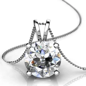 Macro view of round sparkling zircon pendant necklace with classic four-claw setting
