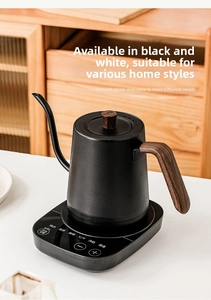 Gooeseneck electric kettle with matte black finish and walnut handle in a cozy home setting