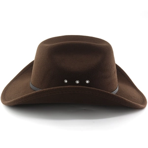 Detail of a dark brown western cowboy hat with metal rivets and black ribbon trim