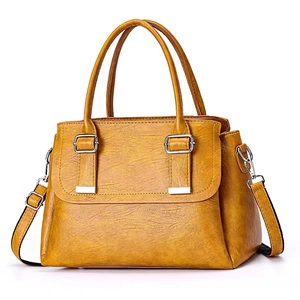 Elegante gelbe quadratische Handtasche aus Kunstleder mit zwei Griffen und Schultergurt