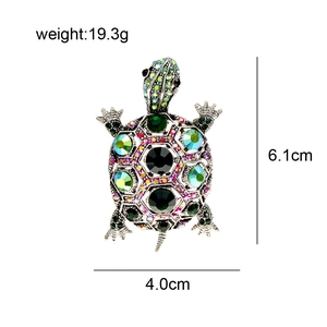 Detailed view of crystal turtle brooch showing dimensions 6.1cm by 4.0cm and 19.3g weight