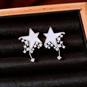 Sterling silver star drop earrings with mother of pearl and cubic zirconia stones