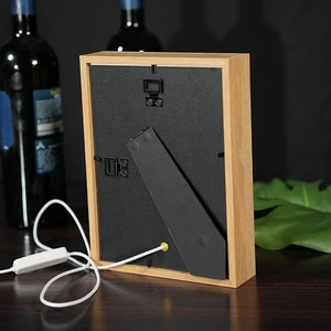 Creative wood light frame back view with stand, power switch, and sleek black backing plate