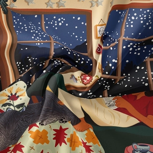 Detail of silk-like bohemian tapestry showing smooth fabric texture and winter illustration