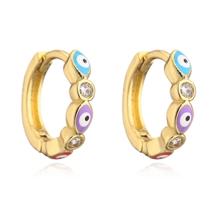 Detail of 18K gold-plated hoop earrings with evil eye enamel patterns and sparkling zircons