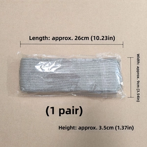Detailansicht der grauen Strick-Beinstulpen in 26x9x3.5cm Verpackung mit Maßen
