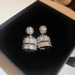 Elegant silver cage earrings with faux pearls and sparkling cubic zirconia in a jewelry box