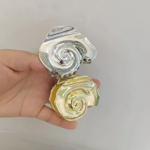 Exaggerated retro conch metal hair clips in gold and silver finish for beach styling
