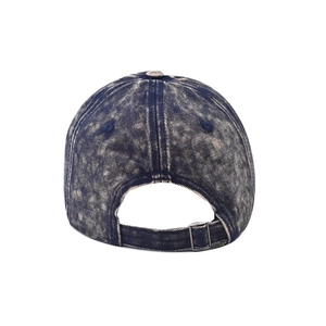 Detail view of the adjustable metal buckle and distressed denim strap on navy baseball cap