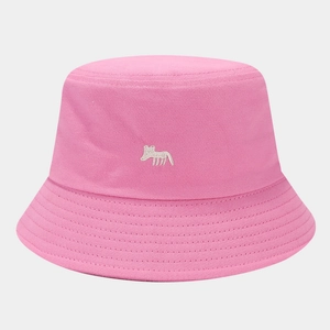 Close-up of pink cotton bucket hat with white fox embroidery and twill texture