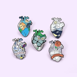 Set of five creative anatomy heart enamel pins with Van Gogh and butterfly artistic designs