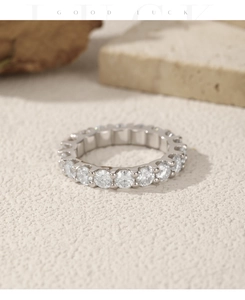 Macro shot of S925 sterling silver eternity ring with full pavé moissanite stones