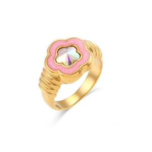 Golden flower ring with pink enamel petals and iridescent gemstone on white background