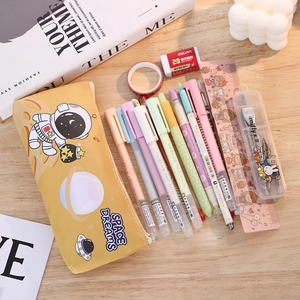 Detailed view of yellow astronaut pencil case with large capacity and stationery layout