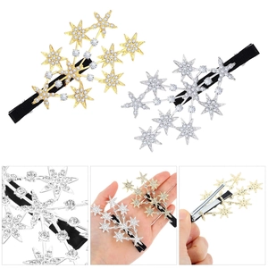 Detail view of sparkling rhinestone star hair clips in gold and silver finishes