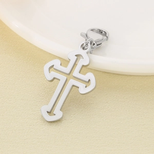 Detailed view of polished hollow cross pendant with lobster clasp attachment