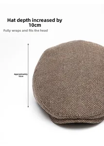 Detail of brown herringbone newsboy cap showing 10cm depth for a full fit and retro wool texture