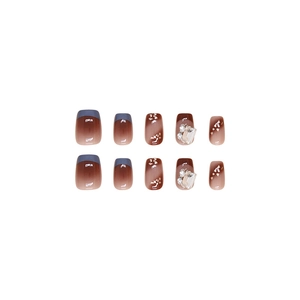 French gradient press-on nails with blue tips, gold foil and large rhinestone accents