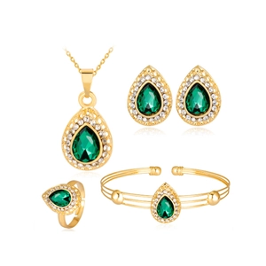 Luxury gold women watch set with green gemstones necklace bracelet and earrings on white