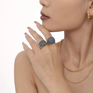Gold plated ring with pave blue zircons shown on model with matching jewelry set