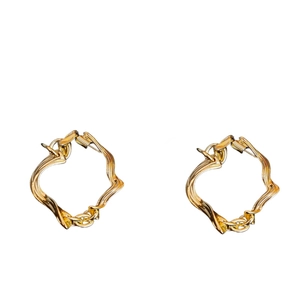 Vintage irregular gold twist earrings with wave texture and chain design on white background