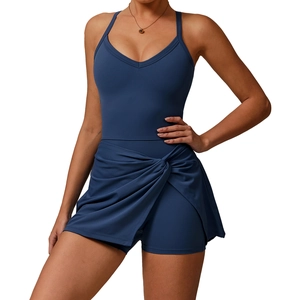 Dark blue athletic romper dress with V-neck straps and a stylish crisscross skirt detail