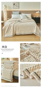 Detail of cream white textured golden turtle fleece blanket with wavy pattern and black hem