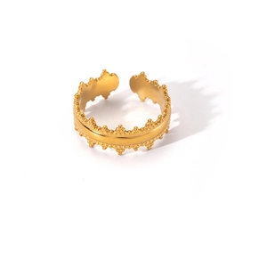 Macro view of gold titanium steel open ring with unique crown edge design on white base