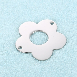 Macro shot of stainless steel five-petal flower charms for DIY jewelry making