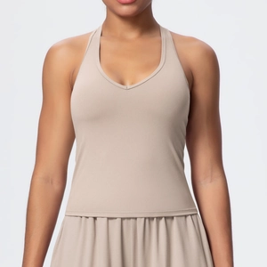 Detailed view of the khaki V-neck sports bra with elastic fabric for fitness and yoga
