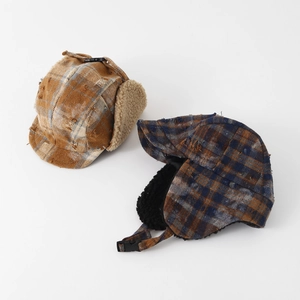 Winter plaid earflap hat for kids featuring warm fleece lining and adjustable buckle strap