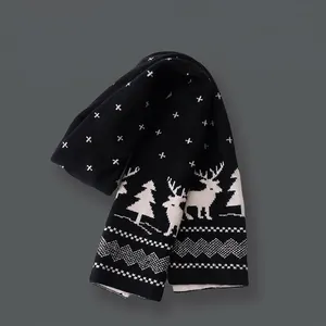 Black knit scarf featuring white reindeer and snowflake motifs for Christmas and winter