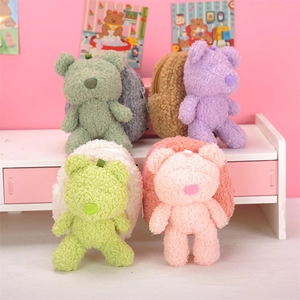 Close-up of assorted colorful plush bear coin purses with soft lamb wool texture