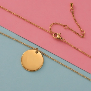 Polished gold circle pendant necklace with adjustable chain and lobster clasp closure