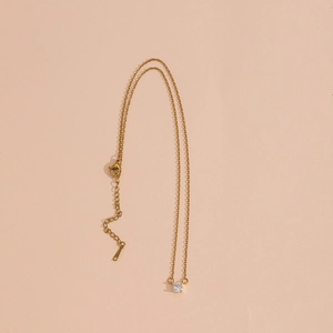 Elegant gold titanium necklace with a round brilliant cut zircon and adjustable clasp