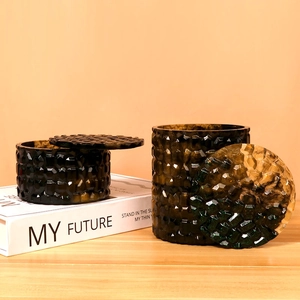 Detailed view of dark amber diamond pattern resin molds for stackable storage boxes
