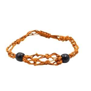 Handwoven adjustable cord necklace with black wooden beads on a white background