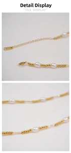 Detailed macro view of 14K gold clasp, adjustable chain and white pearl necklace string